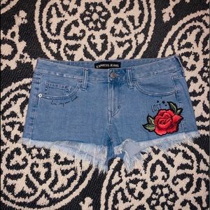 EXPRESS rose appliqué cutoff jeans